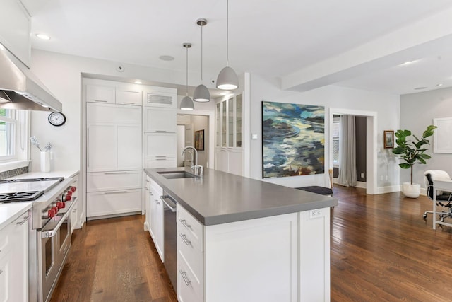 1617 Franklin Ave, Minneapolis, MN 55405 - kitchen featuring a sink, appliances with stainless steel finishes, dark wood-type flooring, a center island with sink, and white cabinetry