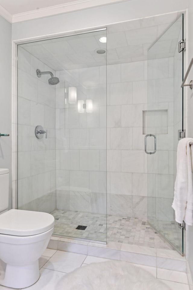 1617 Franklin Ave, Minneapolis, MN 55405 - bathroom with toilet, crown molding, and a shower stall