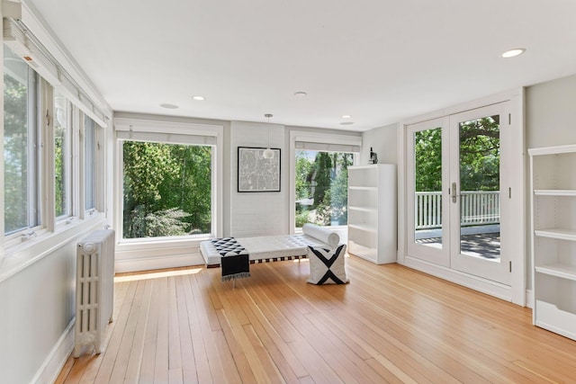 1617 Franklin Ave, Minneapolis, MN 55405 - sitting room with radiator, healthy amount of natural light, light wood-style flooring, and recessed lighting