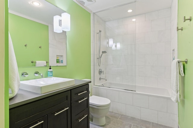 1617 Franklin Ave, Minneapolis, MN 55405 - full bathroom with vanity, toilet, tiled shower / bath, recessed lighting, and tile patterned flooring