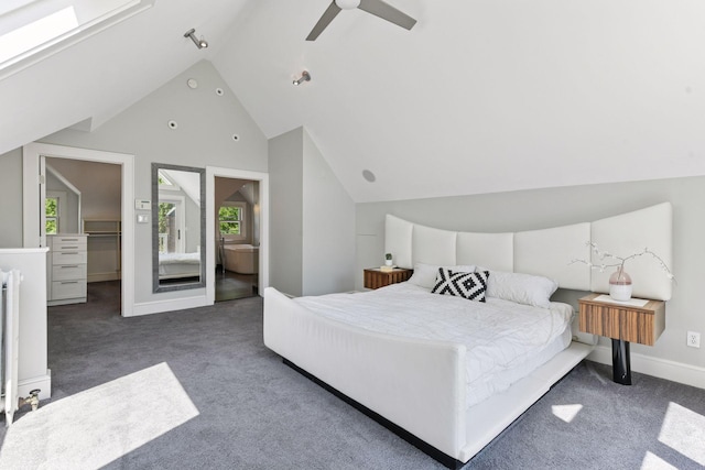 1617 Franklin Ave, Minneapolis, MN 55405 - carpeted bedroom with lofted ceiling, a ceiling fan, a walk in closet, and baseboards