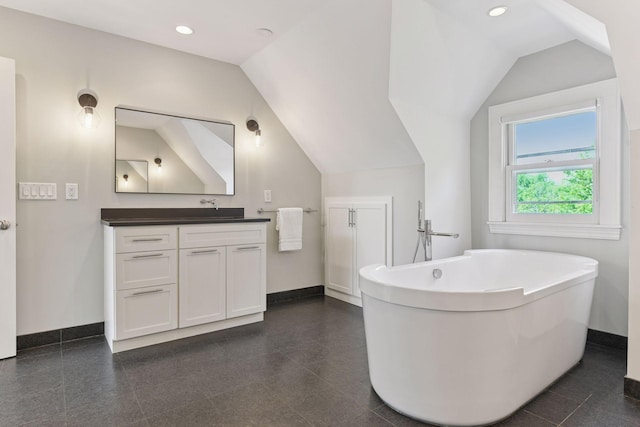 1617 Franklin Ave, Minneapolis, MN 55405 - full bath featuring vanity, a freestanding tub, baseboards, recessed lighting, and vaulted ceiling