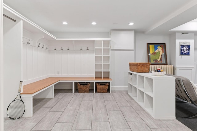 1617 Franklin Ave, Minneapolis, MN 55405 - mudroom with recessed lighting, radiator heating unit, and wood tiled floors