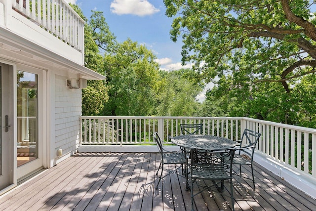 1617 Franklin Ave, Minneapolis, MN 55405 - wooden deck featuring outdoor dining area and view of scattered trees