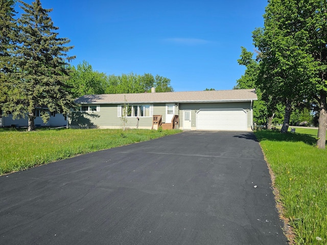 302 Sherwood Ave N, Thief River Falls, MN 56701 - ranch-style house with driveway, a garage, and a front yard