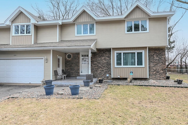 2904 Silver Lake Ct NE, Saint Anthony, MN 55421 - view of front facade featuring an attached garage, brick siding, and driveway