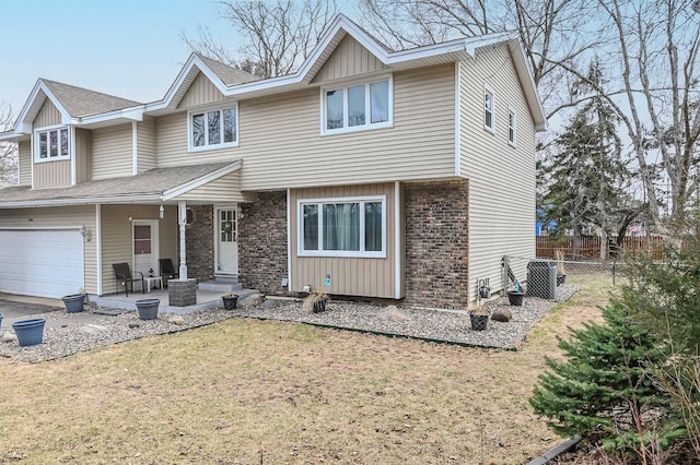 2904 Silver Lake Ct NE, Saint Anthony, MN 55421 - view of front of property featuring an attached garage, brick siding, a porch, and board and batten siding