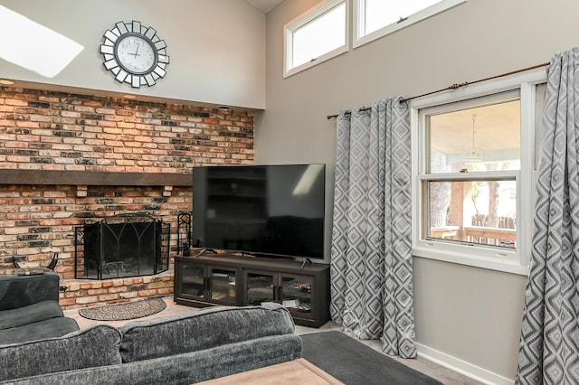 2904 Silver Lake Ct NE, Saint Anthony, MN 55421 - living area featuring baseboards and a brick fireplace