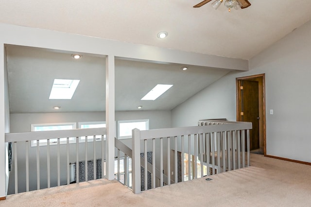 2904 Silver Lake Ct NE, Saint Anthony, MN 55421 - hallway with a skylight, carpet flooring, lofted ceiling, baseboards, and recessed lighting