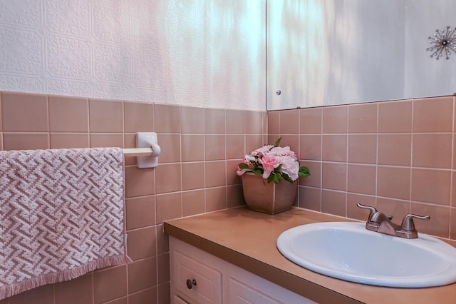 2904 Silver Lake Ct NE, Saint Anthony, MN 55421 - bathroom featuring tile walls, vanity, and decorative backsplash