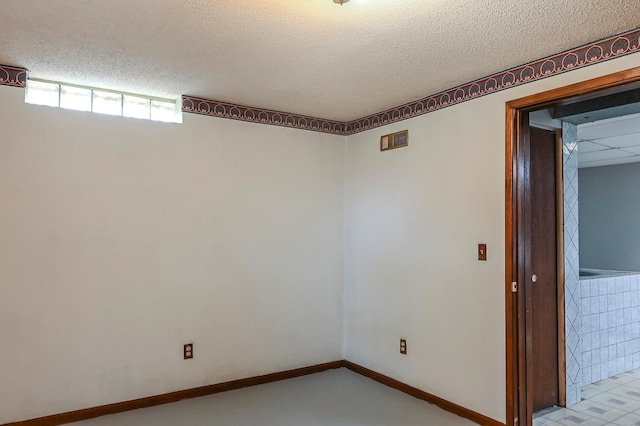 2904 Silver Lake Ct NE, Saint Anthony, MN 55421 - spare room with a textured ceiling and baseboards
