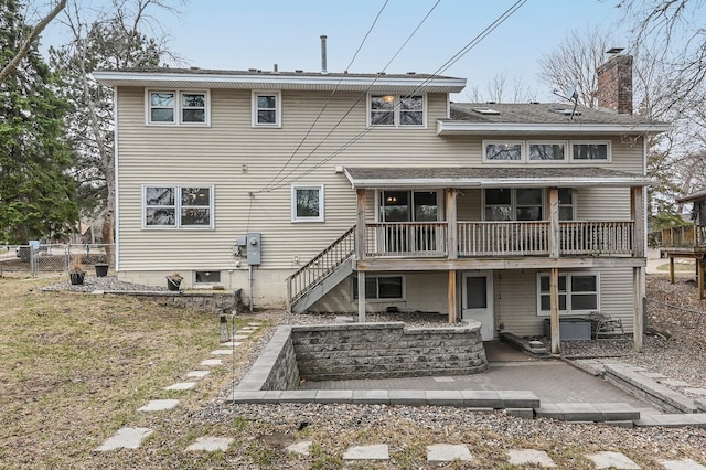 2904 Silver Lake Ct NE, Saint Anthony, MN 55421 - back of house featuring a chimney, a deck, stairway, and roof with shingles