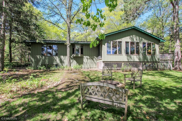 49734 202nd Pl, Mcgregor, MN 55760 - back of property with a yard and a fire pit