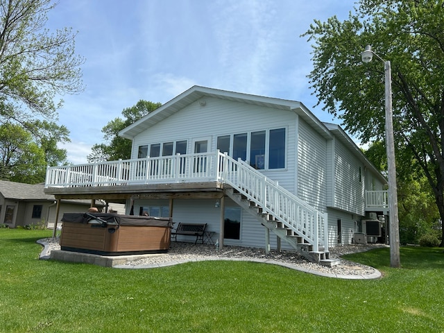 33617 Charlie Trapp Rd, Dent, MN 56528 - back of property featuring a hot tub, a wooden deck, a lawn, and stairs