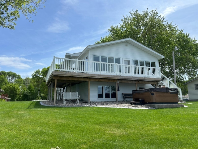 33617 Charlie Trapp Rd, Dent, MN 56528 - rear view of house featuring a hot tub, a deck, and a lawn