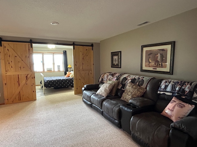 33617 Charlie Trapp Rd, Dent, MN 56528 - living area featuring a barn door and carpet floors