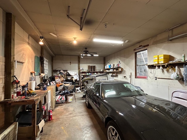 33617 Charlie Trapp Rd, Dent, MN 56528 - garage featuring a workshop area and ceiling fan