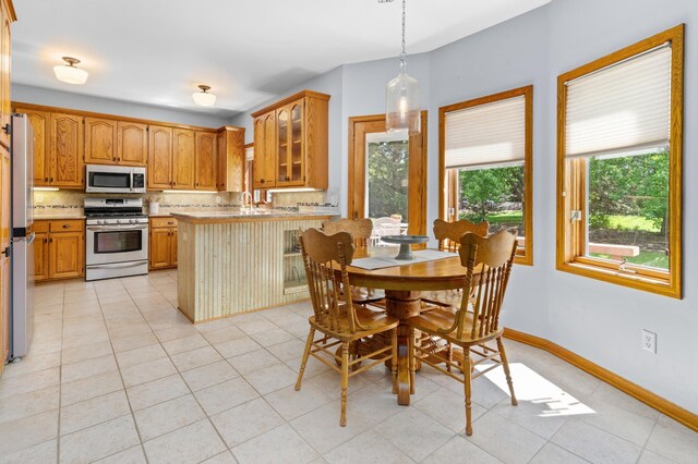 1212 Mill Creek Cir, Saint Cloud, MN 56303 - dining room with baseboards and light tile patterned floors