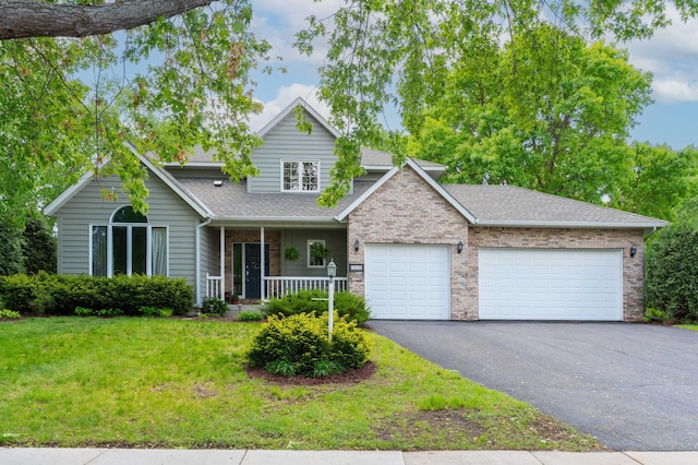 1212 Mill Creek Cir, Saint Cloud, MN 56303 - traditional home with covered porch, an attached garage, asphalt driveway, a front yard, and a shingled roof