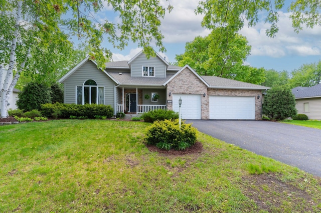 1212 Mill Creek Cir, Saint Cloud, MN 56303 - traditional-style home with a garage, covered porch, a front yard, asphalt driveway, and brick siding