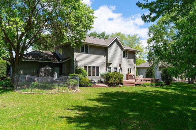 1212 Mill Creek Cir, Saint Cloud, MN 56303 - back of house featuring a deck and a lawn