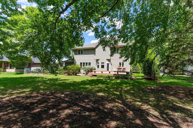 1212 Mill Creek Cir, Saint Cloud, MN 56303 - back of property with a wooden deck and a lawn