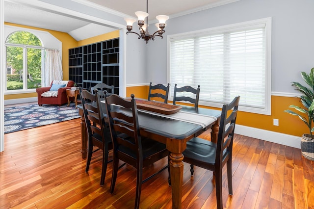 1212 Mill Creek Cir, Saint Cloud, MN 56303 - dining room with a chandelier, wood finished floors, and ornamental molding