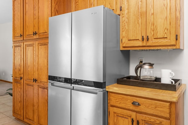 1212 Mill Creek Cir, Saint Cloud, MN 56303 - kitchen featuring freestanding refrigerator and brown cabinets