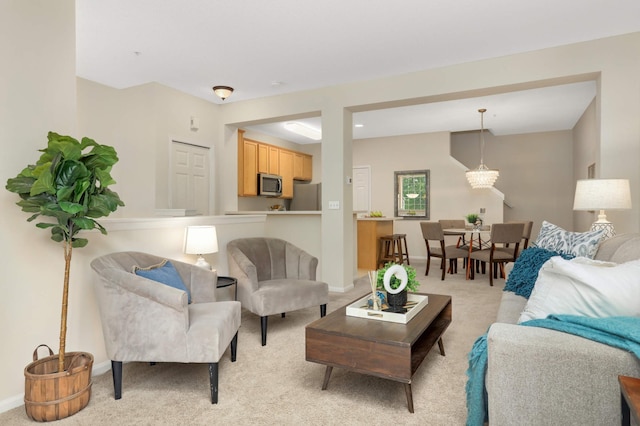 13872 52nd Ave N, Plymouth, MN 55446 - living area with light colored carpet, baseboards, and a chandelier