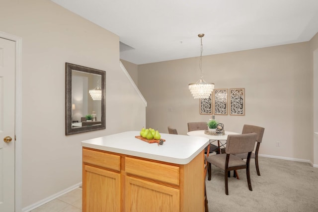 13872 52nd Ave N, Plymouth, MN 55446 - kitchen with a chandelier, baseboards, light countertops, hanging light fixtures, and a kitchen island