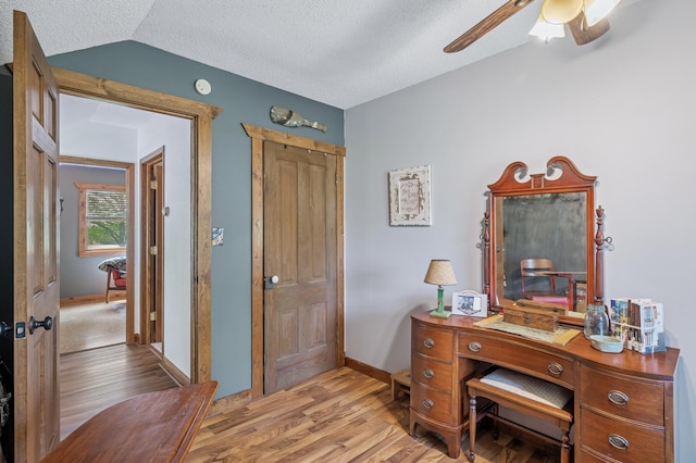12801 40th St NE, Saint Michael, MN 55376 - office space featuring light wood-style floors, ceiling fan, baseboards, lofted ceiling, and a textured ceiling