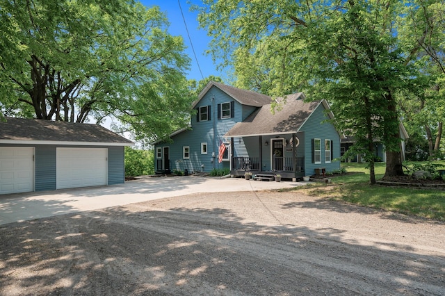 12801 40th St NE, Saint Michael, MN 55376 - view of front of property with an outdoor structure, a shingled roof, a detached garage, and a porch