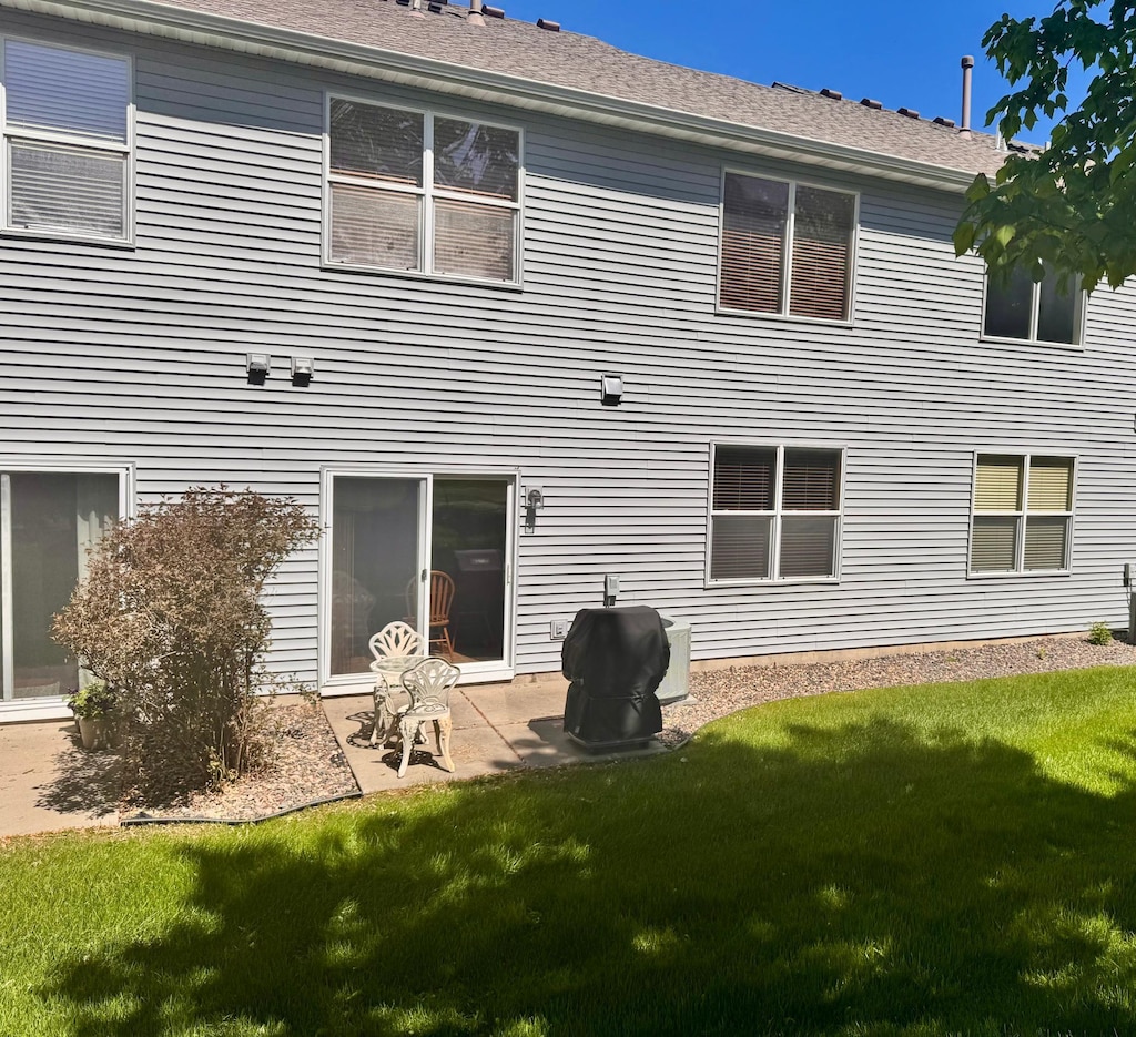 16895 78th Pl N, Maple Grove, MN 55311 - rear view of property with a yard and a patio area