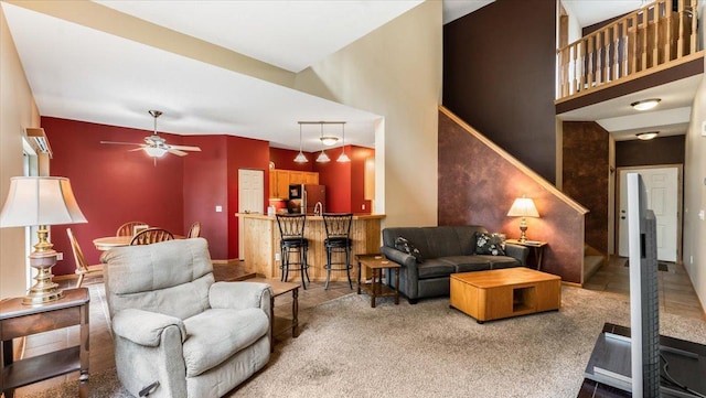 16895 78th Pl N, Maple Grove, MN 55311 - carpeted living area with a ceiling fan, a high ceiling, and stairway