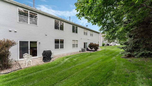 16895 78th Pl N, Maple Grove, MN 55311 - back of house featuring a lawn and a patio