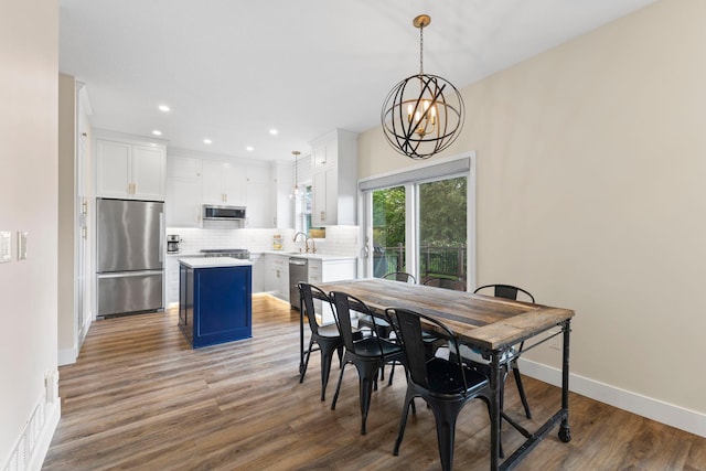 11955 84th Pl N, Maple Grove, MN 55369 - dining space with wood finished floors, recessed lighting, baseboards, and a chandelier