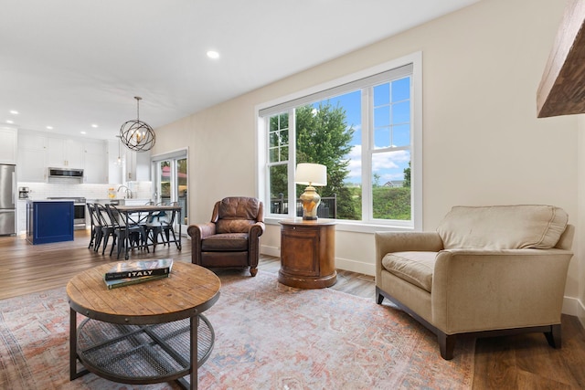 11955 84th Pl N, Maple Grove, MN 55369 - living room featuring wood finished floors, recessed lighting, a chandelier, and baseboards