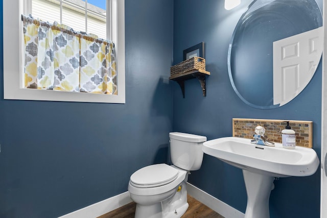 11955 84th Pl N, Maple Grove, MN 55369 - bathroom featuring baseboards, wood finished floors, and toilet
