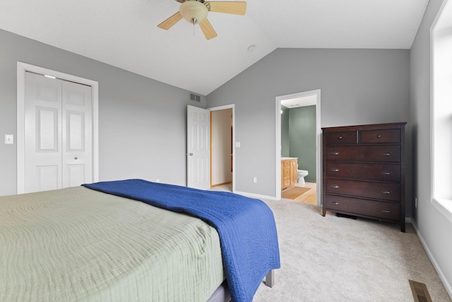 11955 84th Pl N, Maple Grove, MN 55369 - carpeted bedroom featuring lofted ceiling, a closet, baseboards, ceiling fan, and connected bathroom