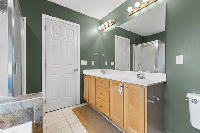 11955 84th Pl N, Maple Grove, MN 55369 - bathroom featuring double vanity, a stall shower, tile patterned floors, a tub to relax in, and toilet