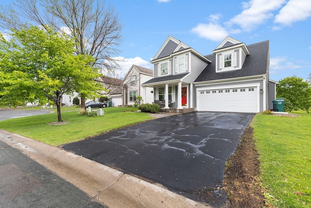 11955 84th Pl N, Maple Grove, MN 55369 - view of front facade featuring asphalt driveway, a front yard, covered porch, a shingled roof, and an attached garage