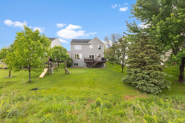 11955 84th Pl N, Maple Grove, MN 55369 - rear view of house with a wooden deck and a lawn