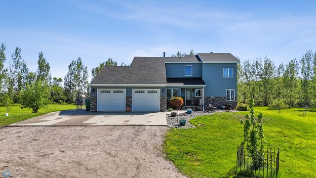 6056 170th Ave SE, Walcott, ND 58077 - view of front of home with driveway, an attached garage, a front lawn, and roof with shingles