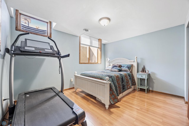 6056 170th Ave SE, Walcott, ND 58077 - bedroom with baseboards and light wood-style floors