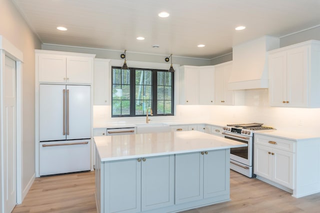 29655 E Horseshoe Lake Rd, Mission Twp, MN 56465 - kitchen featuring white appliances, a center island, light wood-style flooring, a sink, and decorative backsplash