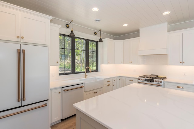 29655 E Horseshoe Lake Rd, Mission Twp, MN 56465 - kitchen with high end appliances, recessed lighting, a sink, custom exhaust hood, and white cabinetry