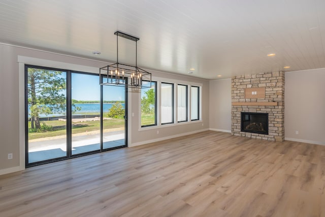 29655 E Horseshoe Lake Rd, Mission Twp, MN 56465 - unfurnished living room featuring a chandelier, healthy amount of natural light, light wood-style floors, baseboards, and recessed lighting