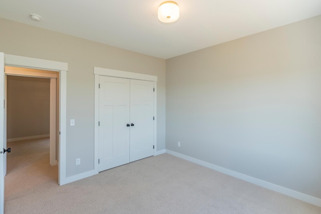 29655 E Horseshoe Lake Rd, Mission Twp, MN 56465 - unfurnished bedroom with light colored carpet, baseboards, and a closet