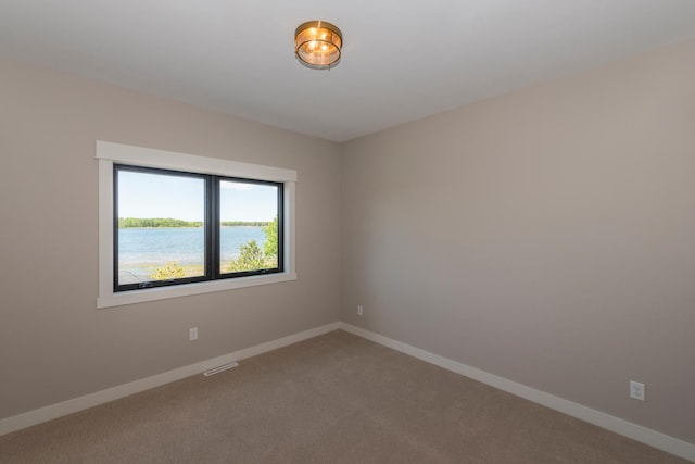 29655 E Horseshoe Lake Rd, Mission Twp, MN 56465 - spare room featuring carpet and baseboards