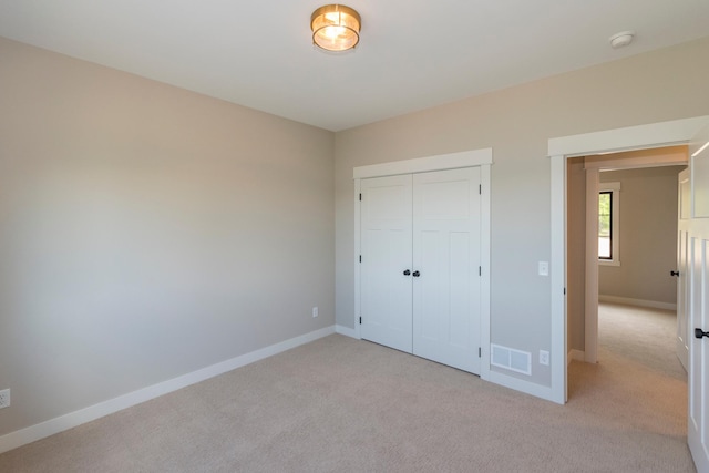 29655 E Horseshoe Lake Rd, Mission Twp, MN 56465 - unfurnished bedroom featuring light colored carpet, baseboards, and a closet